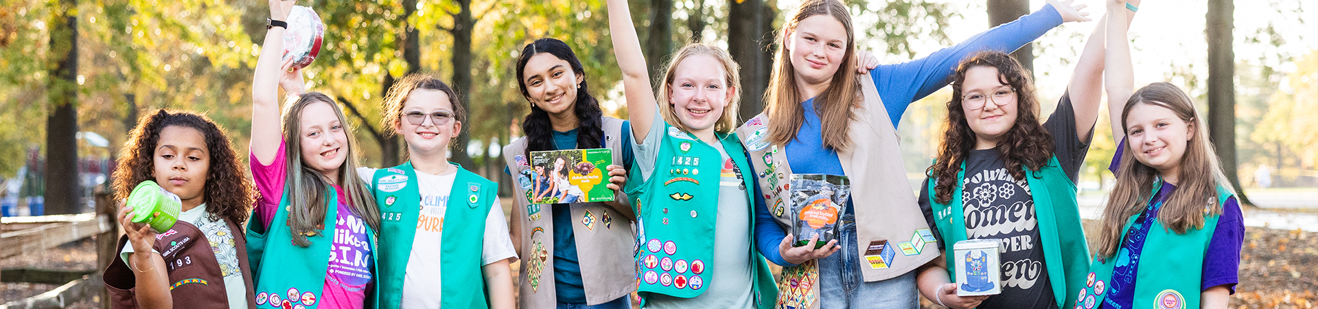  girl holding fall product items 
