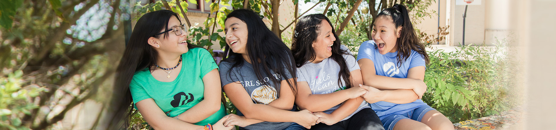  girl scouts outside laughing 