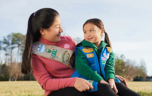 volunteer talking with girl scout