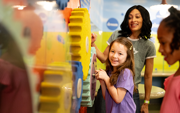 volunteer talking with girl scout