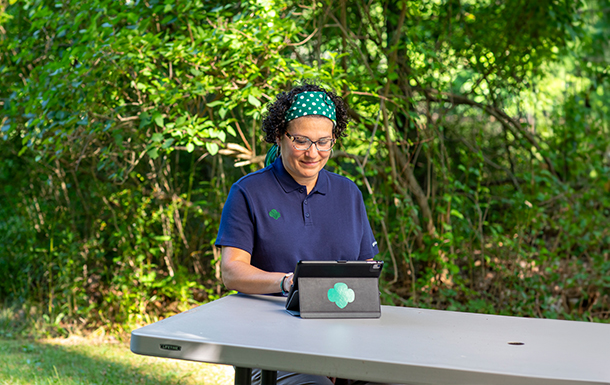 volunteer outside using tablet