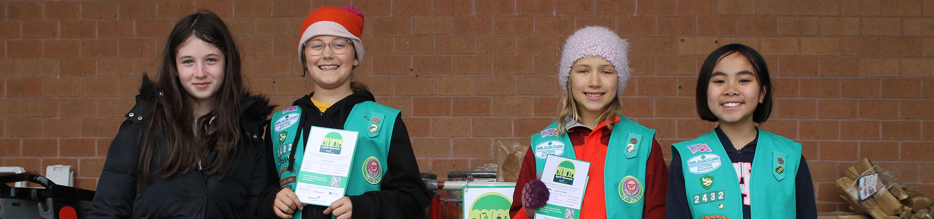  girls collecting items for april showers 