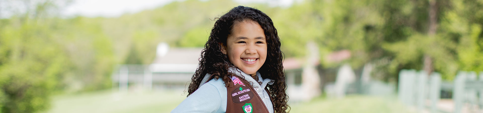  girl scout outside at camp 